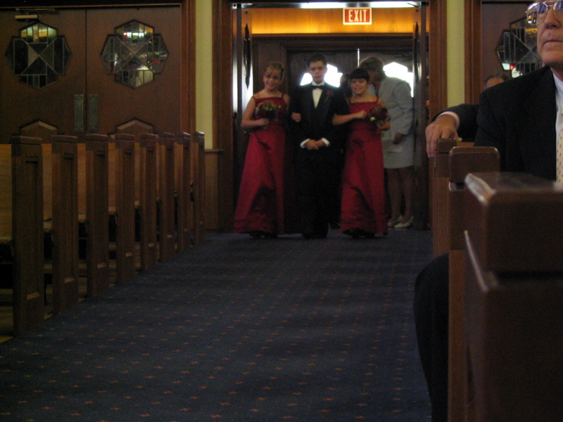 The Junior Groomsman Approaches with Junior Bridesmaids