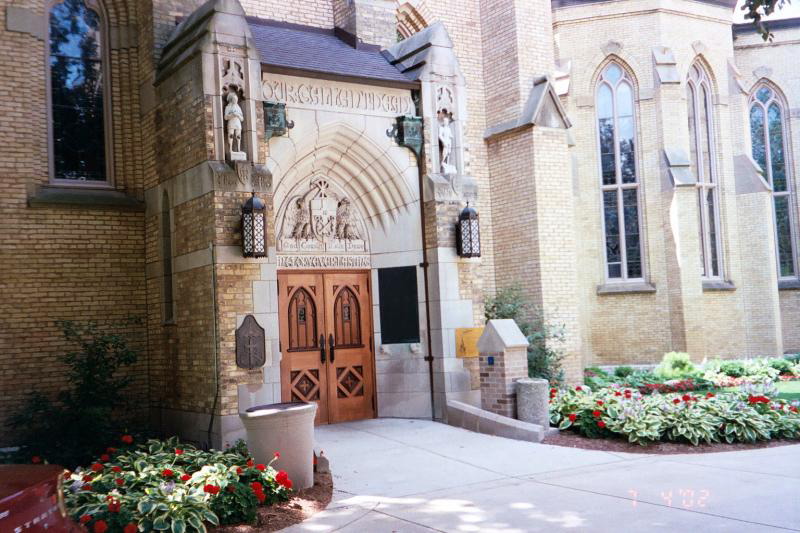 God, Country, Notre Dame. The side-entrance to the Basilica.